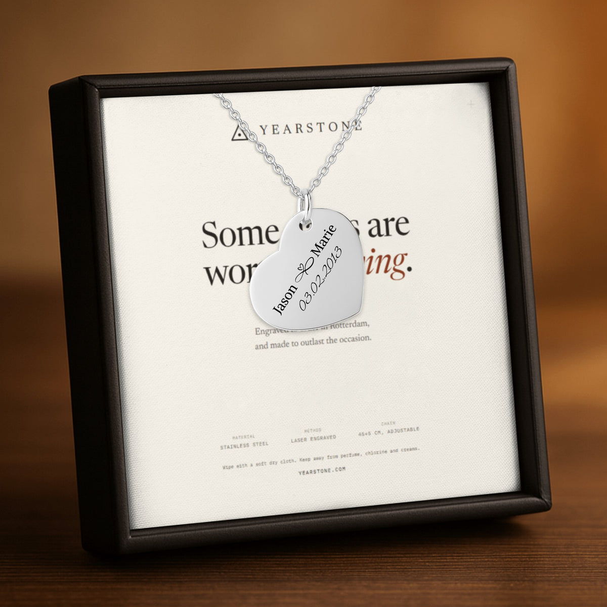 Stainless steel engraved heart necklace presented on a Yearstone card