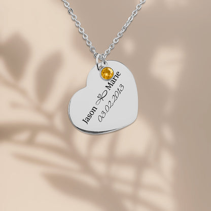 Stainless steel heart pendant engraved with two names and a date